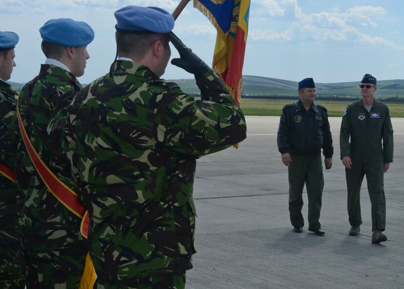 U.S. Air Force Lt. Gen. Darryl Roberson, 3rd Air Force and 17th Expeditionary Air Force commander, right, and Romanian air force Col. Marius Oatu, 71st Air Base commander, center right, prepare to inspect a detail of Romanian air force airmen on the flightline at Campia Turzii, Romania, April 16, 2015.  The airmen welcomed the general to the installation on his visit to observe the progress made by the U.S. Air Force's 354th Expeditionary Fighter Squadron and Romanian air force's 71st Air Base as part of a theater security package. (U.S. Air Force photo by Staff Sgt. Joe W. McFadden/Released)