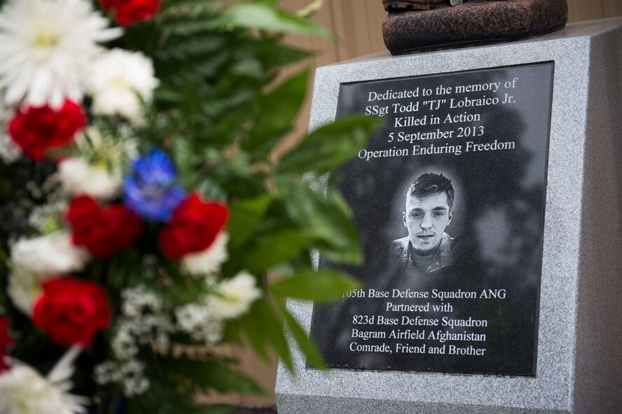 A memorial for U.S. Air Force Staff Sgt. Todd Lobraico Jr., 823d Base Defense Squadron, rests on display during the 2015 Safeside Reunion April 11, 2015, at Moody Air Force Base, Ga. Lobraico was killed in action in September 2013 after discovering an Afghan insurgent force heading for his fireteam during a contingency mission outside of Bagram Airfield, Afghanistan. (U.S. Air Force photo by Airman 1st Class Dillian Bamman/Released)