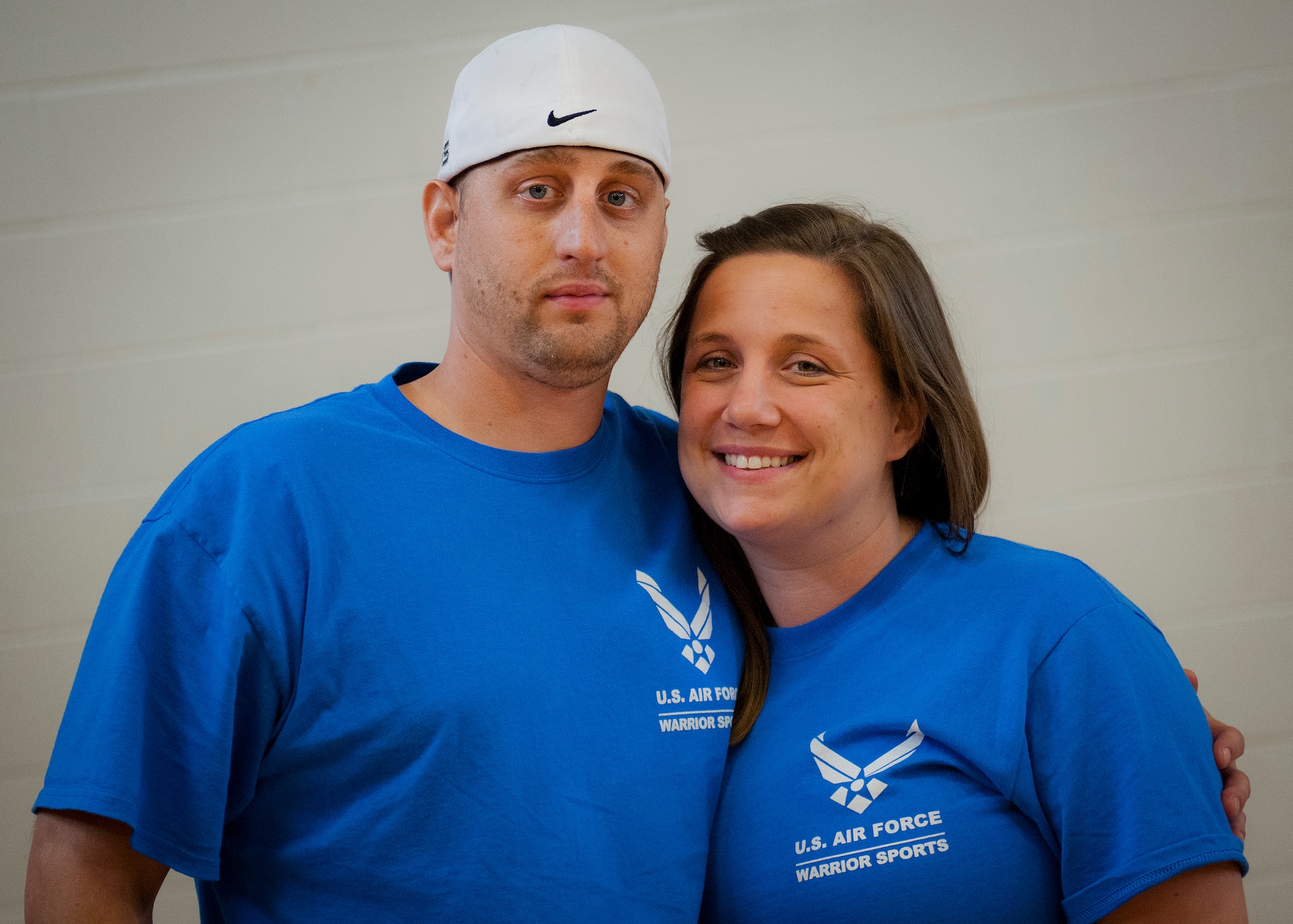 Senior Airman Chris Fugitt, a retired 96th Aircraft Maintenance Squadron Airman, and his wife and caregiver, Megan, stand strong together at the week-long adaptive sports and rehabilitation camp at Eglin Air Force Base, Fla.  Two years after complications from a massive stroke forced Chris to retire from the Air Force, his warrior spirit enabled him to power past a number of debilitating setbacks and attend his first camp.  (U.S. Air Force photo/Samuel King Jr.)