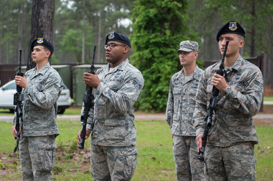 Airmen from the 820th Base Defense Group present arms after a 3-volley salute for U.S. Air Force Staff Sgt. Todd Lobraico Jr., who was killed in action in September 2013, during the 2015 Safeside Reunion April 11, 2015, at Moody Air Force Base, Ga. Airman 1st Class LeeBernard Chavis was also recognized during the ceremony after being killed in action in Baghdad October 2006. (U.S. Air Force photo by Airman 1st Class Dillian Bamman/Released)