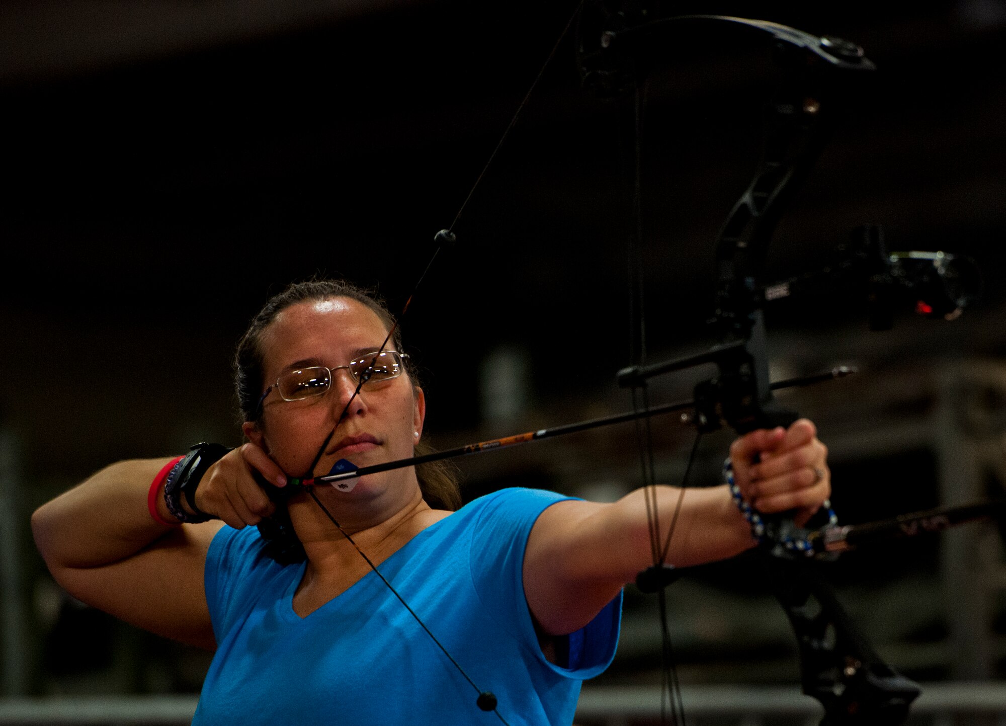 Amanda Frey, an Air Force Wounded Warrior athlete, lines up her shot during an archery class at the fourth day of an introductory adaptive sports and rehabilitation camp at Eglin Air Force Base, Fla., April 16. The DOD’s military adaptive sports program enhances warrior recovery by engaging wounded, ill and injured service members in ongoing, daily adaptive activities, based on their interest and ability. (U.S. Air Force photo/Samuel King Jr.)