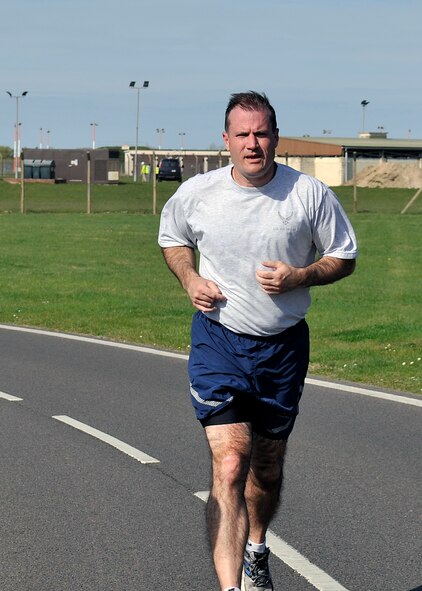 U.S. Air Force Col. Kenneth T. Bibb Jr., 100th Air Refueling Wing commander, runs with Team Mildenhall during a Holocaust Remembrance ruck march and monthly wing 5K run April 16, 2015, on RAF Mildenhall, England. The wing 5K was Col. Bibb’s last one here as commander, as he prepares for his change of command. (U.S. Air Force photo by Airman 1st Class Kyla Gifford/Released)