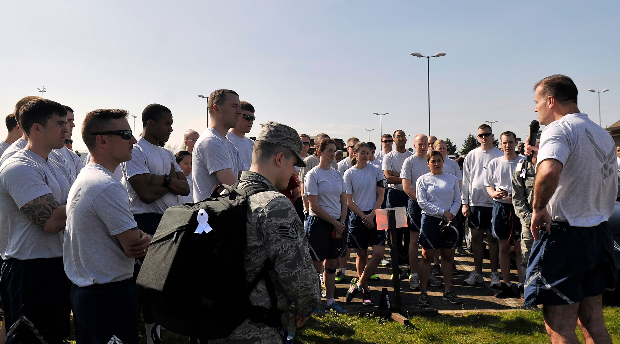 U.S. Air Force Col. Kenneth T. Bibb Jr., 100th Air Refueling Wing commander, speaks to Team Mildenhall members before a Holocaust Remembrance ruck march and monthly wing 5K run April 16, 2015, on RAF Mildenhall, England. The ruck was held in honor of Holocaust Remembrance Week, and Team Mildenhall came together to show their support. (U.S. Air Force photo by Airman 1st Class Kyla Gifford/Released)