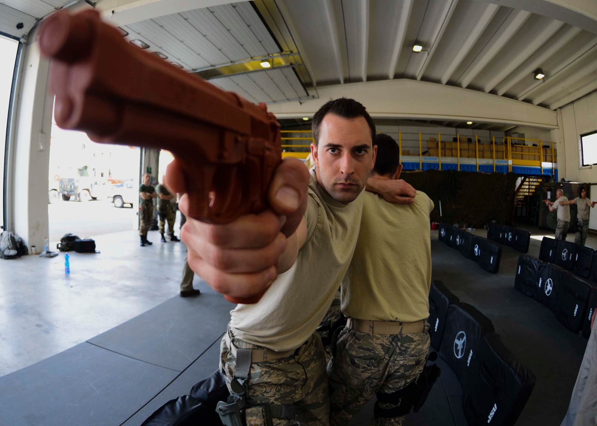 U.S. Air Force Staff Sgt. Zachary Lowery, 31st Security Forces Squadron security response team leader, practices room entry during a week-long combat expertise training program April 14, 2015, at Aviano Air Base, Italy. The training included weapons handling techniques, such as reloading, aiming and weapon switching. (U.S. Air Force photo by Senior Airman Austin Harvill/Released)