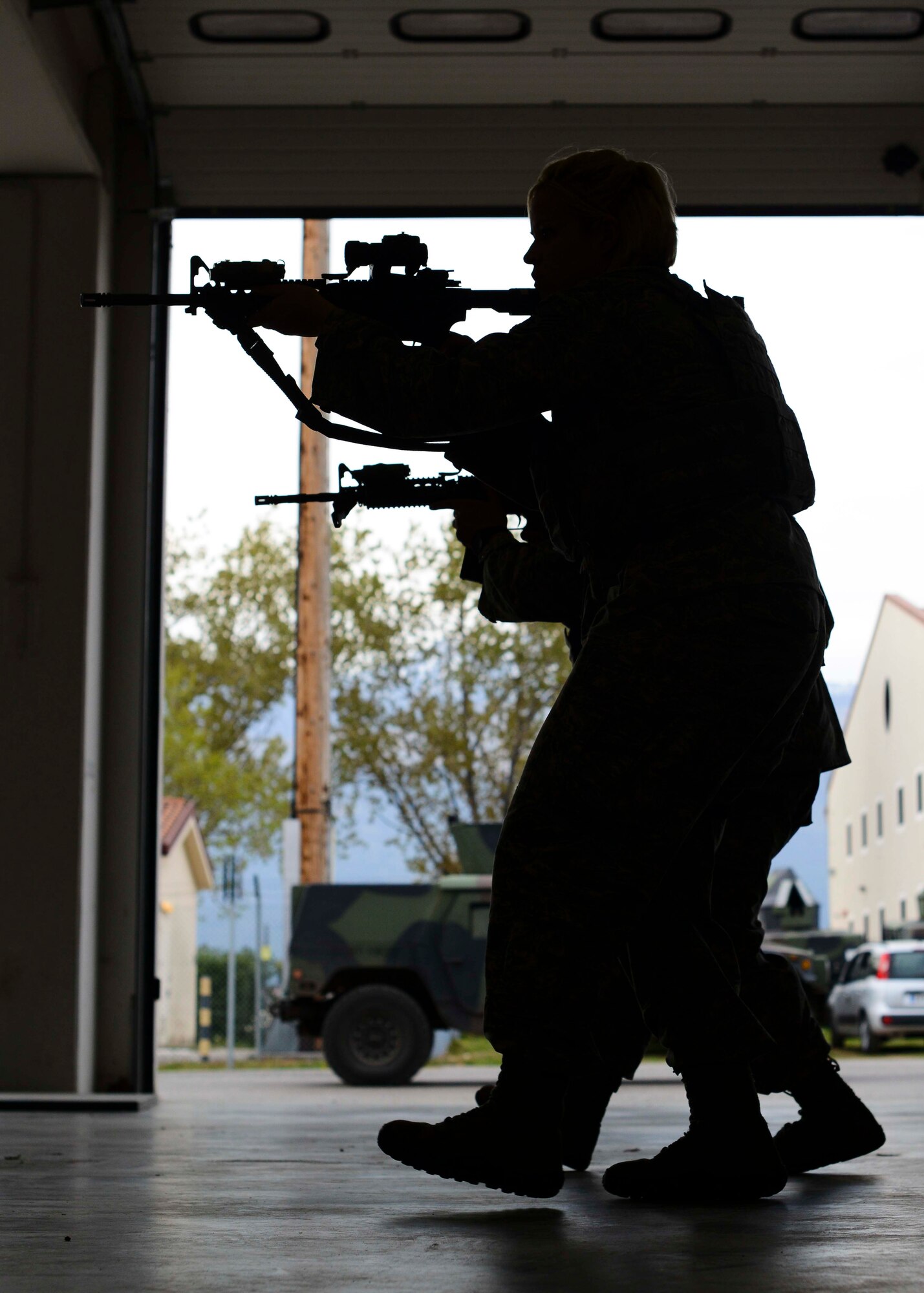 Airmen from the 31st Security Forces Squadron practice target tracking during a week-long combat expertise training program, April 14, 2015, at Aviano Air Base, Italy. Airmen learned several different building-block motions to better familiarize themselves with more complex maneuvers. (U.S. Air Force photo by Senior Airman Austin Harvill/Released)
