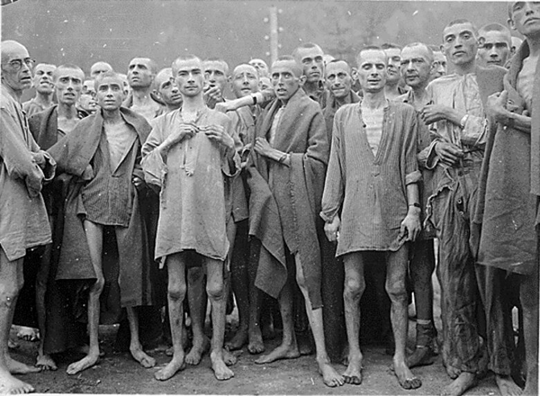 Holocaust survivors of Ebensee Camp, Austria, stand for a photo following their liberation, May 1945. (Courtesy photo)
