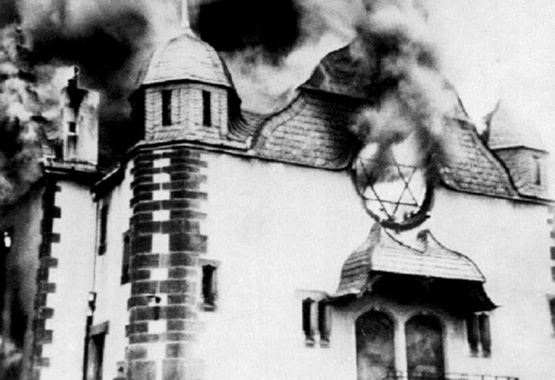 Flames billow from a synagogue during its destruction on Kristallnacht, also known as the “Night of Broken Glass,” Germany, November 1938. (Courtesy photo)