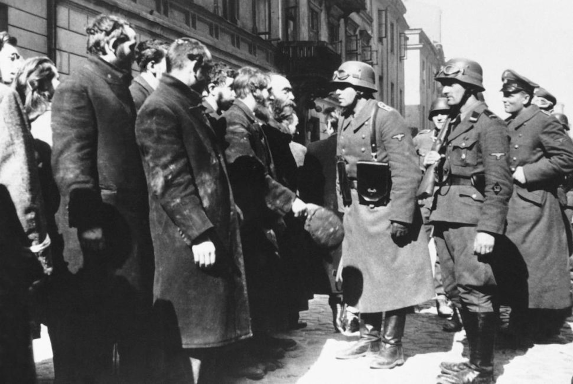 An SS sergeant interrogates Jews captured during the suppression of the Warsaw Ghetto Uprising, 1943. (Courtesy photo)