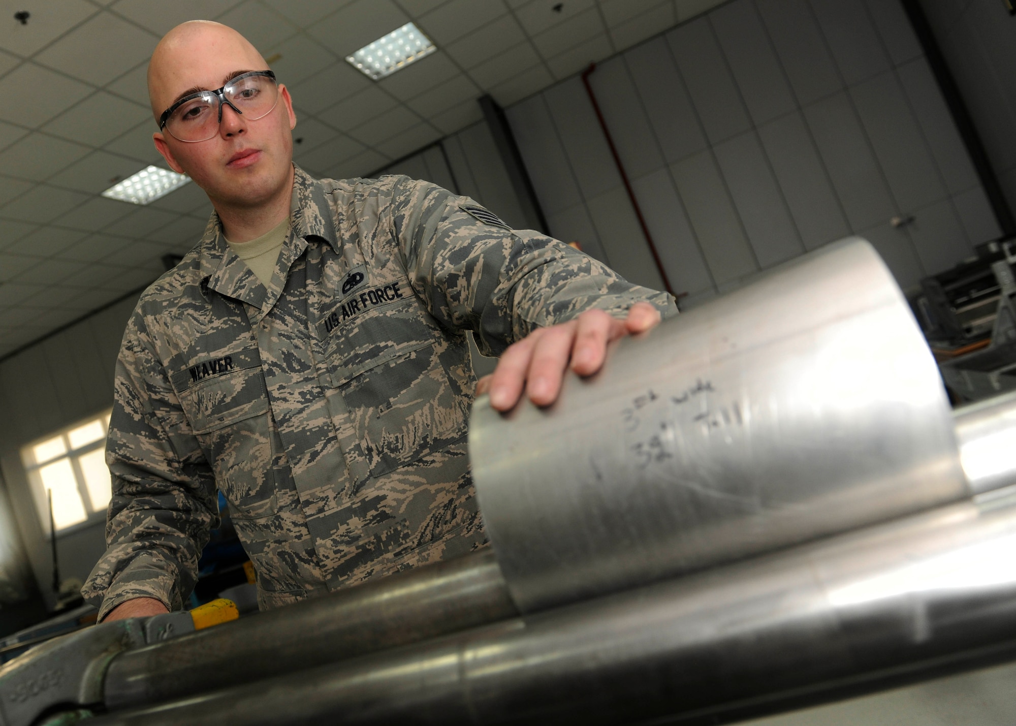 Staff Sgt. Travis Weaver, 39th Maintenance Squadron sheet metal aircraft structural maintenance craftsman, bends metal tubing April 6, 2015, at Incirlik Air Base, Turkey. The sheet metal shop performs numerous tasks such as repair, corrosion control, and composite repairs to help keep the mission going both air and ground. (U.S. Air Force photo by Senior Airman Krystal Ardrey/Released)  