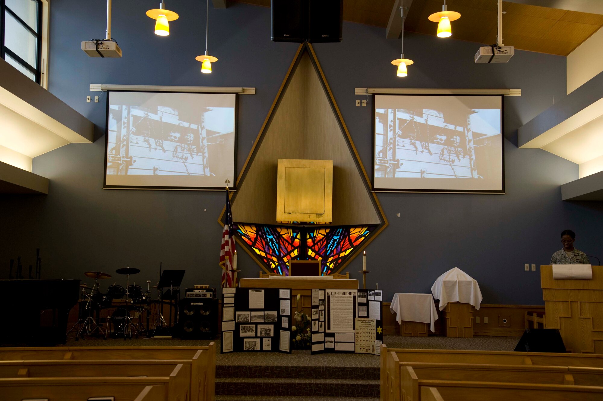 U.S. Air Force Staff Sgt. Janaya Bryant, 35th Fighter Wing executive assistant to the command chief, prepares to read names of Holocaust victims during a ceremony in the base chapel at Misawa Air Base, Japan, April 13, 2015. Volunteers read the names of victims over a span of six hours as a way to pay respect to those persecuted and massacred between 1933 and 1945 by the Nazi regime. (U.S. Air Force Airman 1st Class Jordyn Fetter/Released)