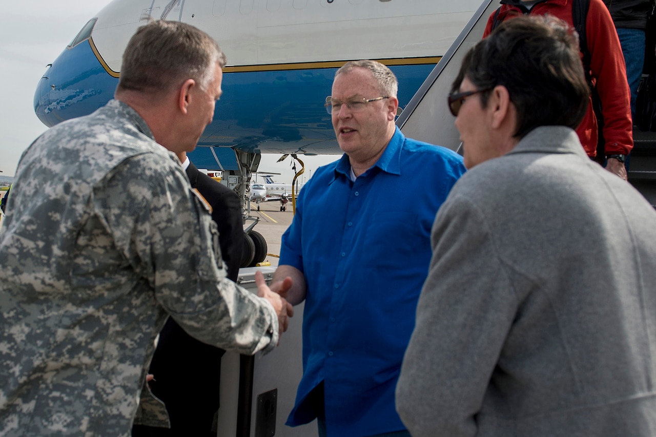 Deputy Defense Secretary Bob Work, center, is greeted by Army Lt. Gen. William Garrett, deputy commander of U.S. European Command, as he arrives on Stuttgart Army Airfield in Stuttgart, Germany, April 16, 2015. DoD photo by Air Force Master Sgt. Adrian Cadiz