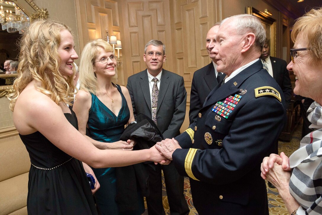 Army Gen. Martin E. Dempsey, chairman of the Joint Chiefs of Staff, meets Emily Elizabeth Kliewer, Navy Child of the Year nominee, during the annual Military Child of the Year awards gala in Arlington, Va., April 16, 2015. 