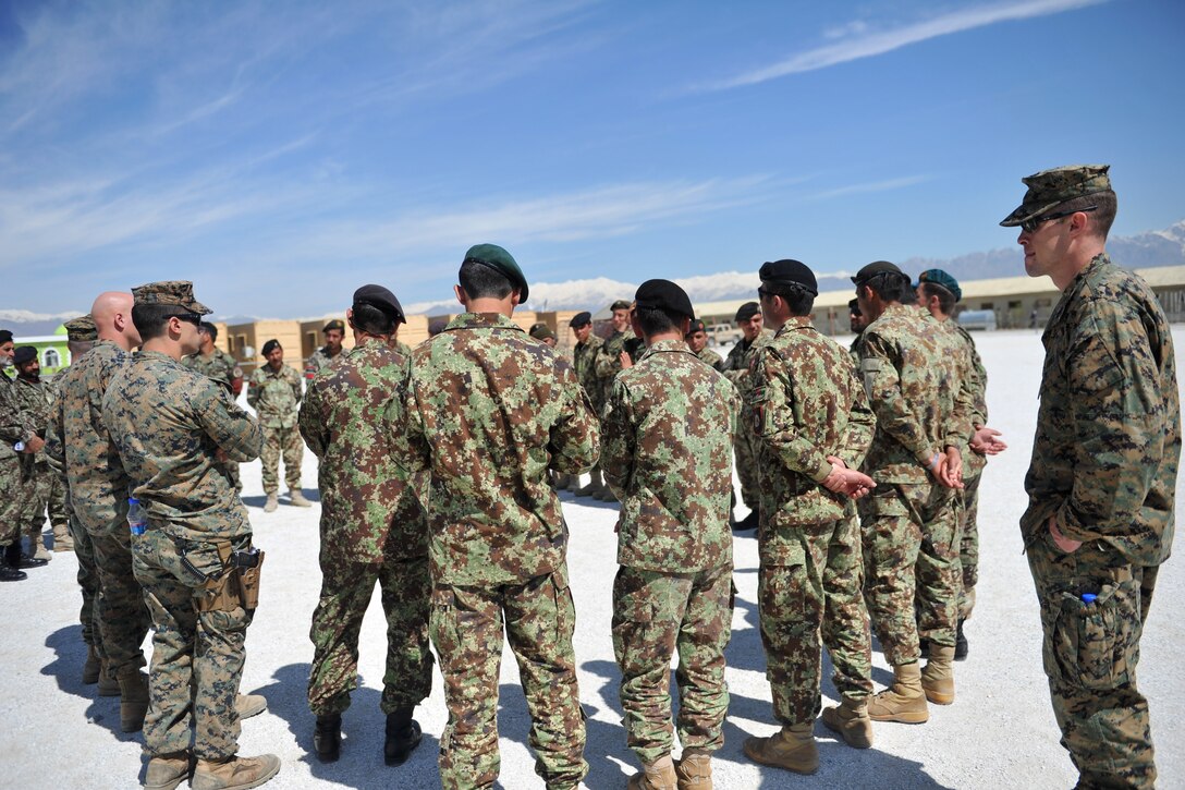 U.S. Marines conduct an after-action review with Afghan military policemen after conducting infantry tactics and techniques training at the Afghan Military Police Guard Compound in Parwan province, Afghanistan, April 5, 2015.