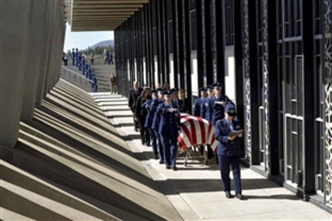 Air Force Rabbi (Maj.) Sarah Schechter reads from the Torah while the honor guard escorts the casket containing the remains of Capt. Richard D. Chorlins into the Cadet Chapel at the U.S. Air Force Academy, Colo., April 14, 2015. Chorlins was killed in Vietnam in January 1970. His remains were transferred to the academy in a dignified arrival ceremony for burial in the Academy Cemetery April 14, 2015. Schechter is a Cadet Chapel Jewish chaplain. 