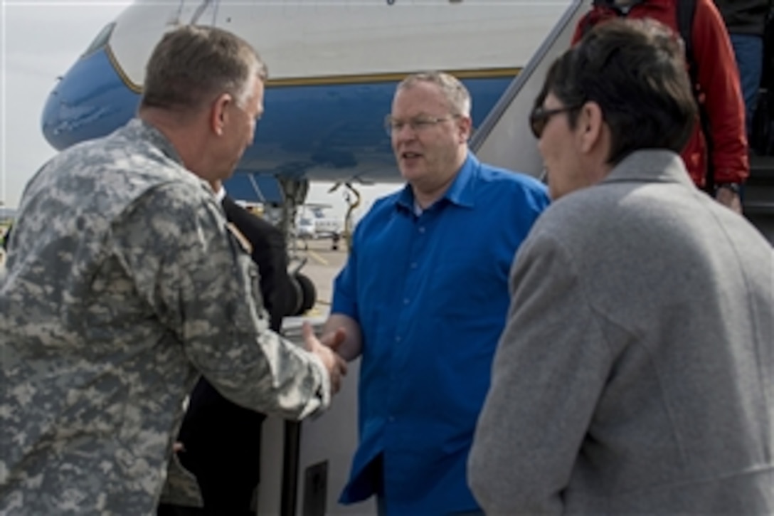 U.S. Deputy Defense Secretary Bob Work, center, is greeted by U.S. Lt. Gen. William Garrett, deputy commander, U.S. European Command as he arrives on Stuttgart Army Airfield in Stuttgart, Germany, April 16, 2015, to meet with leaders of U.S. European Command.