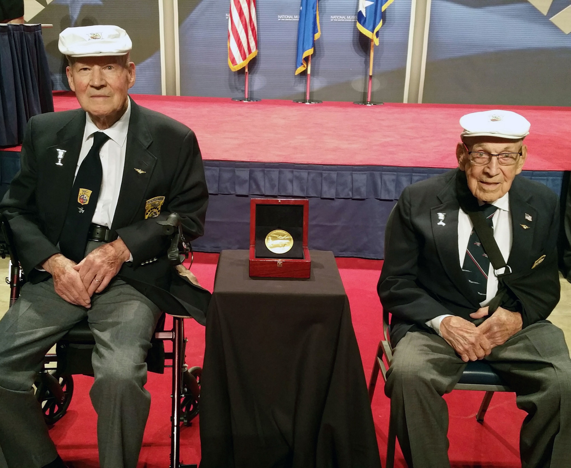 Doolittle Raiders Lt. Col. Richard Cole, co-pilot of Crew No. 1, and Staff Sgt. David Thatcher, engineer-gunner of Crew No. 7, with the Congressional Gold Medal. The medal is on display in the museum’s World War II Gallery in the Doolittle Raid exhibit. (U.S. Air Force photo)
