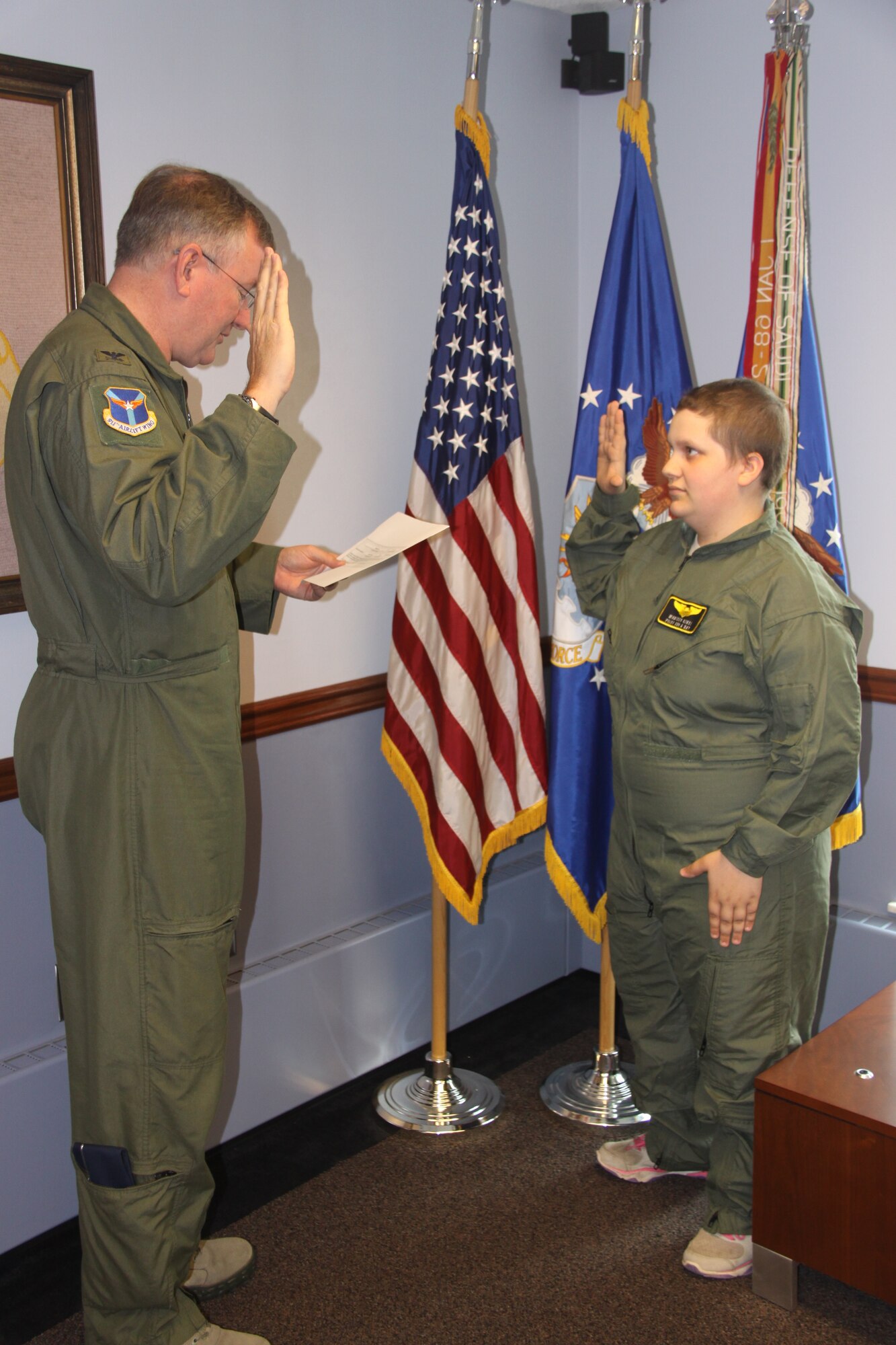 Madison Kikel of Latrobe, Pa., visited the 911th Airlift Wing April 17, 2015. During her visit, she was honored as a "Pilot for a Day" and made an honorary Second Lieutenant and honorary Navy Lieutenant. Kikel was diagnosed with cancer in April of 2014; Kikel and her parents are part of the significant local support for the 911th AW. (U.S. Air Force photo by Master Sgt. Mark Winklosky)
