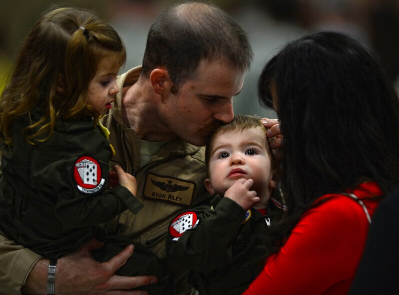 A U.S. Air Force Airman assigned to the 20th Fighter Wing returns from a deployment at Shaw Air Force Base, S.C., April 18, 2015. Approximately 200 Airmen deployed to the United States Central Command AOR for six month. (U.S. Air Force photo by Senior Airman Jensen Stidham/Released)