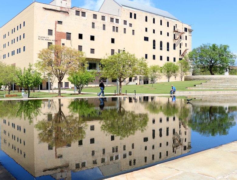 The Journal Record Building sustained major damage in the blast on April 19, 1995. It now houses the Oklahoma City Memorial Museum. In the far left, the American Elm known as the "Survivors' Tree" is now an iconic symbol of Oklahoma City's resilience following the bombing.