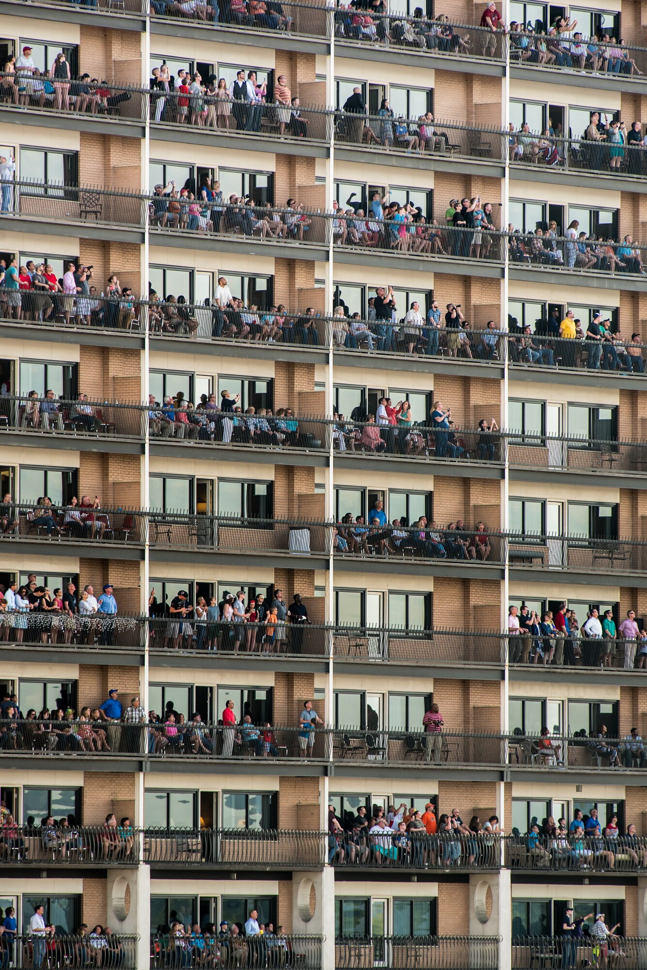 Guests at The Galt House Hotel watch aircraft perform in the Thunder Over Louisville air show April 18, 2015, in Louisville, Ky. More than 650,000 people lined the banks of the Ohio River for the six-hour event. (U.S. Air National Guard photo by Maj. Dale Greer)