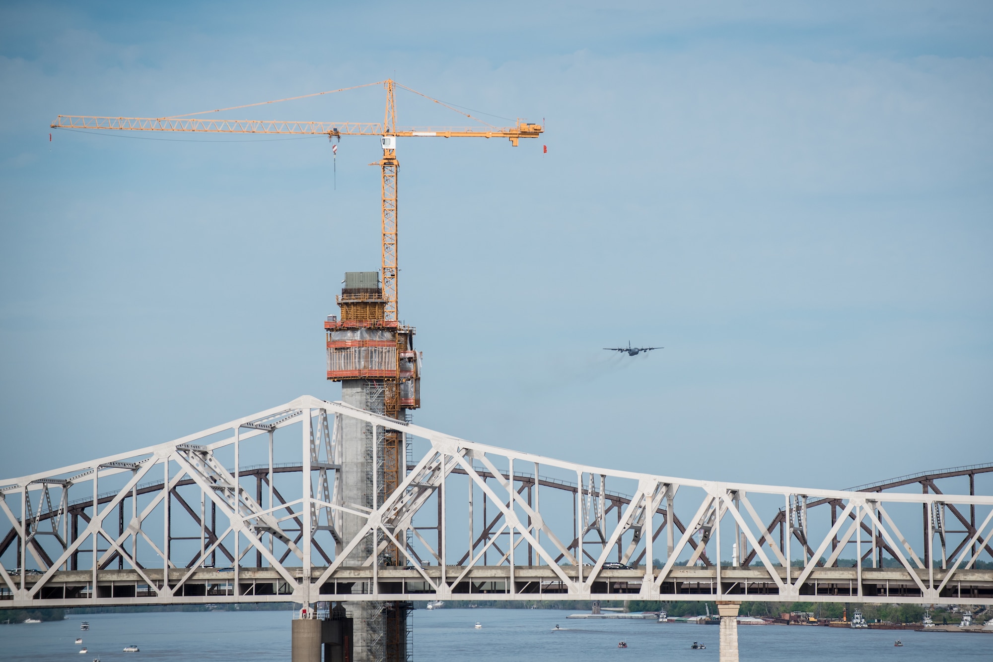 A Kentucky Air National Guard C-130 Hercules aircraft approaches downtown Louisville, Ky., to perform an air drop in the Thunder Over Louisville air show April 18, 2015. More than 650,000 people lined the banks of the Ohio River for the six-hour show. (U.S. Air National Guard photo by Maj. Dale Greer)