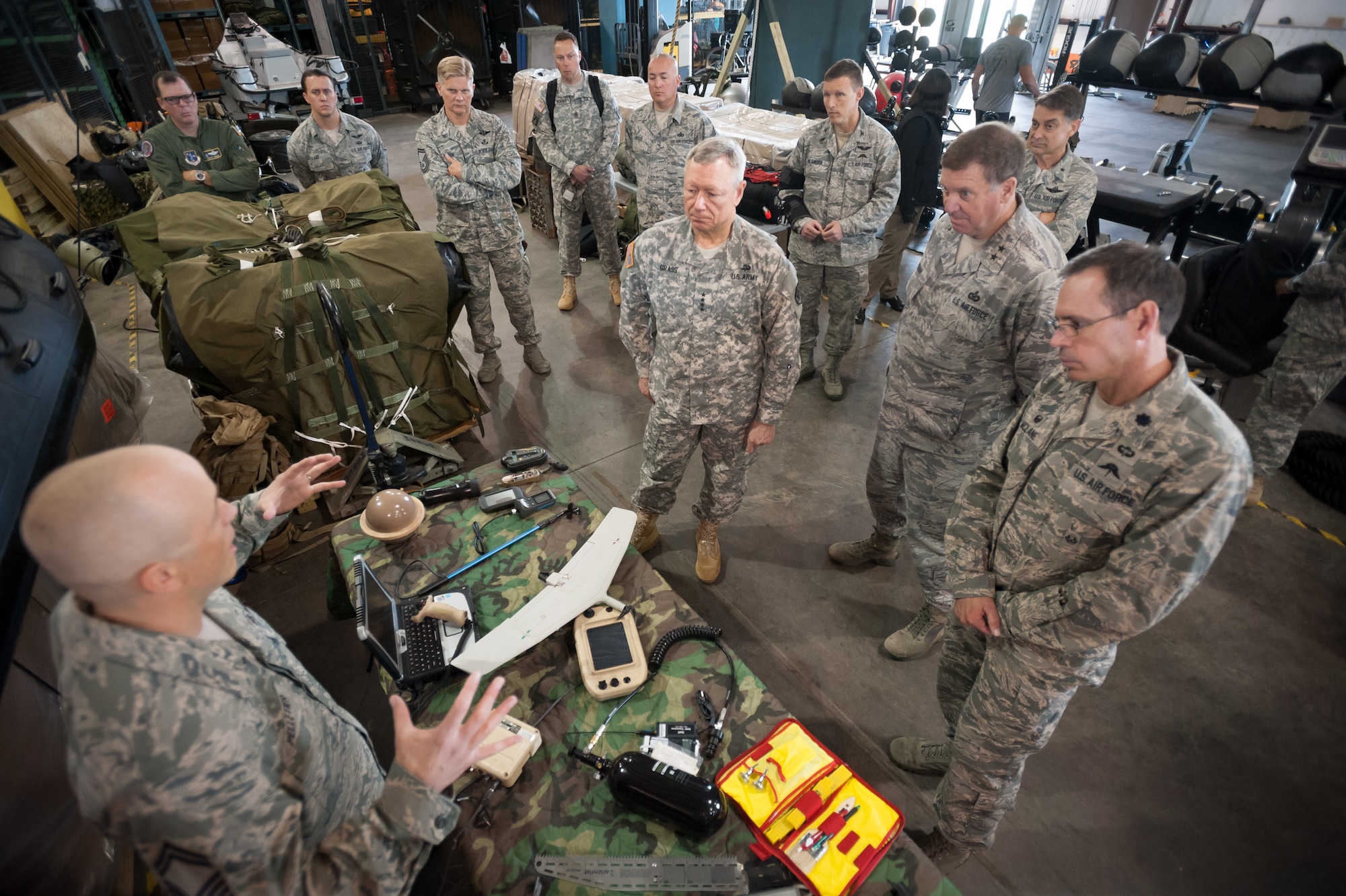 Army Gen. Frank J. Grass, chief of the National Guard Bureau, receives a mission brief from members of the 123rd Special Tactics Squadron during a tour of the Kentucky Air National Guard Base in Louisville, Ky., April 18, 2015. The 123rd is the only special tactics unit in the Air National Guard with both combat controllers and pararescuemen. (U.S. Air National Guard photo by Maj. Dale Greer)