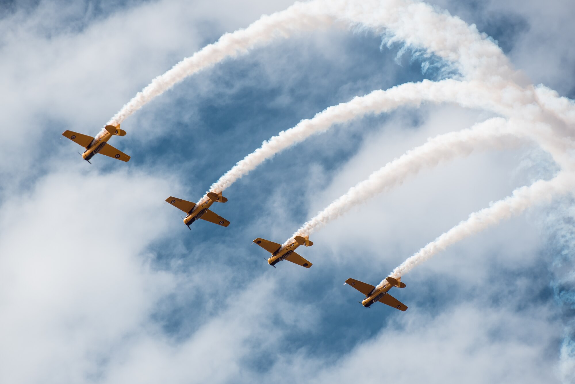The Canadian Harvard Aerobatic Team performs during the Thunder Over Louisville air show April 18, 2015, in Louisville, Ky. More than 650,000 people lined the banks of the Ohio River to see the show. (U.S. Air National Guard photo by Maj. Dale Greer)
