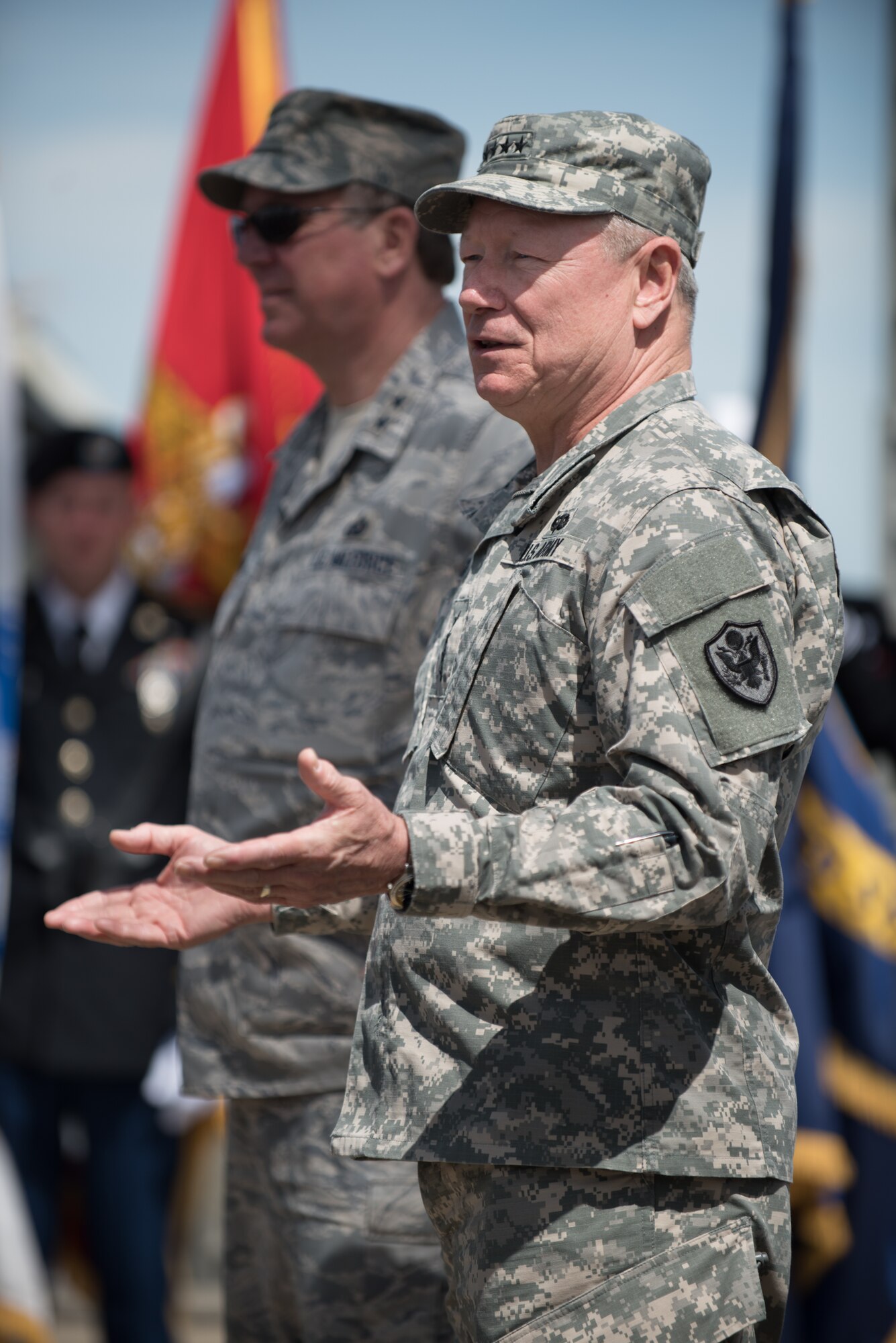 Army Gen. Frank J. Grass, chief of the National Guard Bureau, thanks a group of 20 Kentucky National Guard Soldiers and Airmen for their service following a mass swearing-in ceremony on the Clark Memorial Bridge in downtown Louisville, Ky., April 18, 2015. Grass administered the oath of enlistment during the ceremony, which kicked off the Thunder Over Louisville air show. (U.S. Air National Guard photo by Maj. Dale Greer)