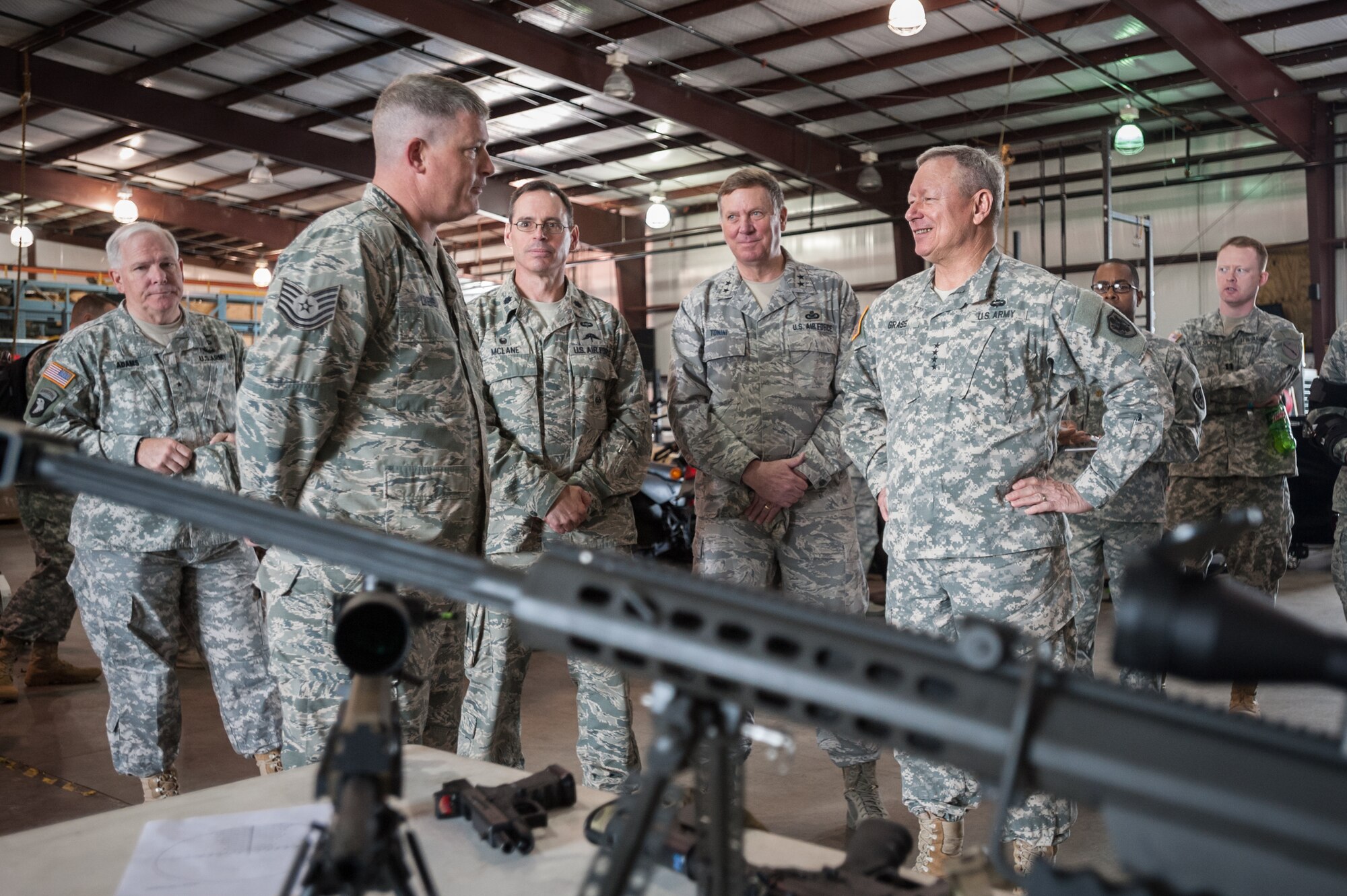Army Gen. Frank J. Grass (right), chief of the National Guard Bureau, receives a mission brief from members of the 123rd Special Tactics Squadron during a tour of the Kentucky Air National Guard Base in Louisville, Ky., April 18, 2015. Grass also attended the Thunder Over Louisville air show April 18 as the guest of Kentucky's adjutant general, Maj. Gen. Edward W. Tonini. The Kentucky Air Guard provided logistical support for military aircraft flying the show, including the U.S. Air Force Thunderbirds. (U.S. Air National Guard photo by Maj. Dale Greer)
