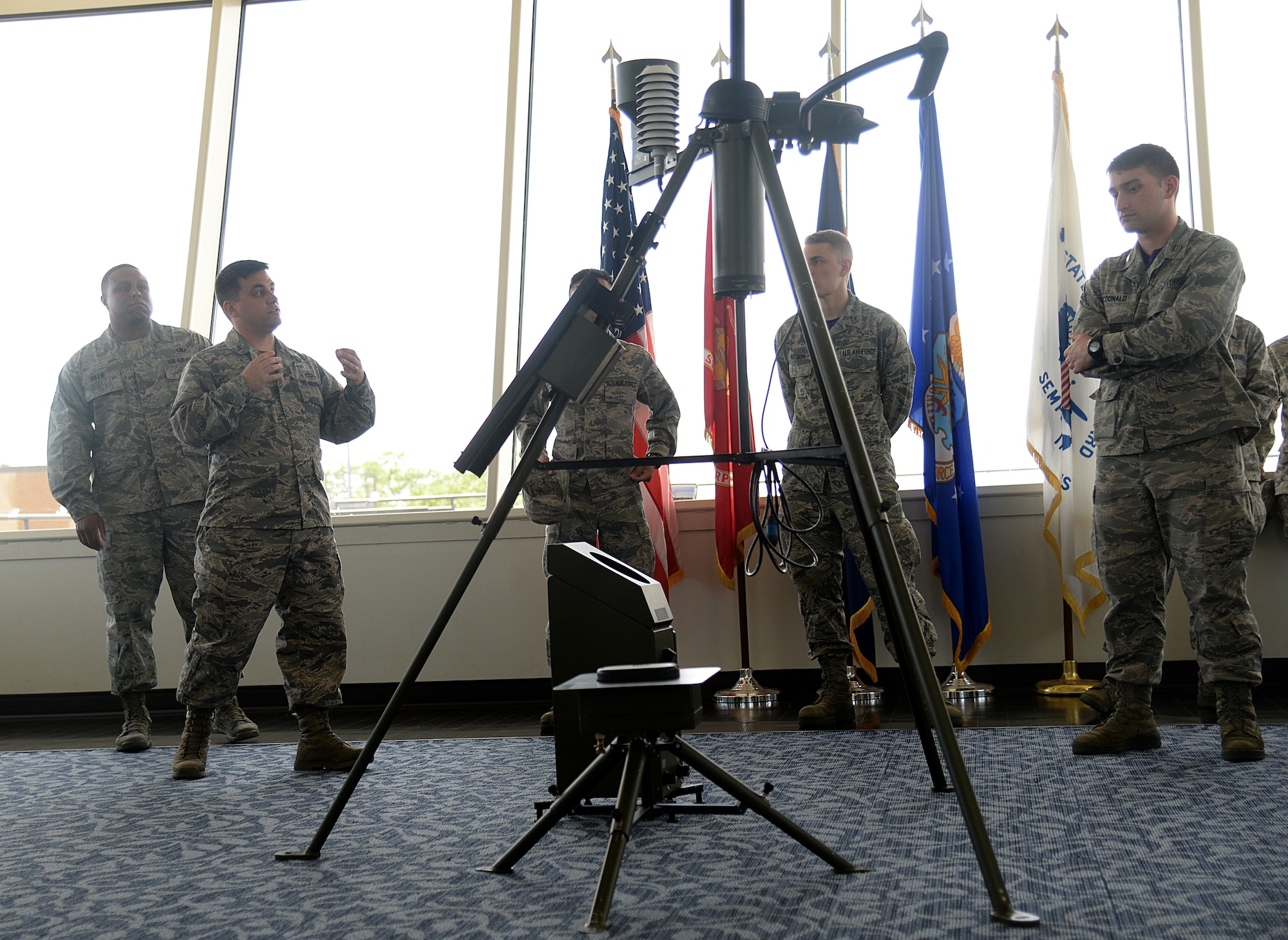 Capt. Christopher Homan, 335th Training Squadron instructor, explains the mission capabilities of the 335th TRS Weather Training Facility to students of the Southeast and Southwest Region Air Force ROTC Detachments during the “Pathways to Blue” diversity outreach event April 17, 2015, Keesler Air Force Base, Miss. Hosted by 2nd Air Force, the event provides a way to demonstrate Keesler’s and Air Education and Training Command’s technical and flight training capabilities while informing cadets about career choices available in the Air Force when deciding what path to take after college. (U.S. Air Force photo by Senior Airman Holly Mansfield)