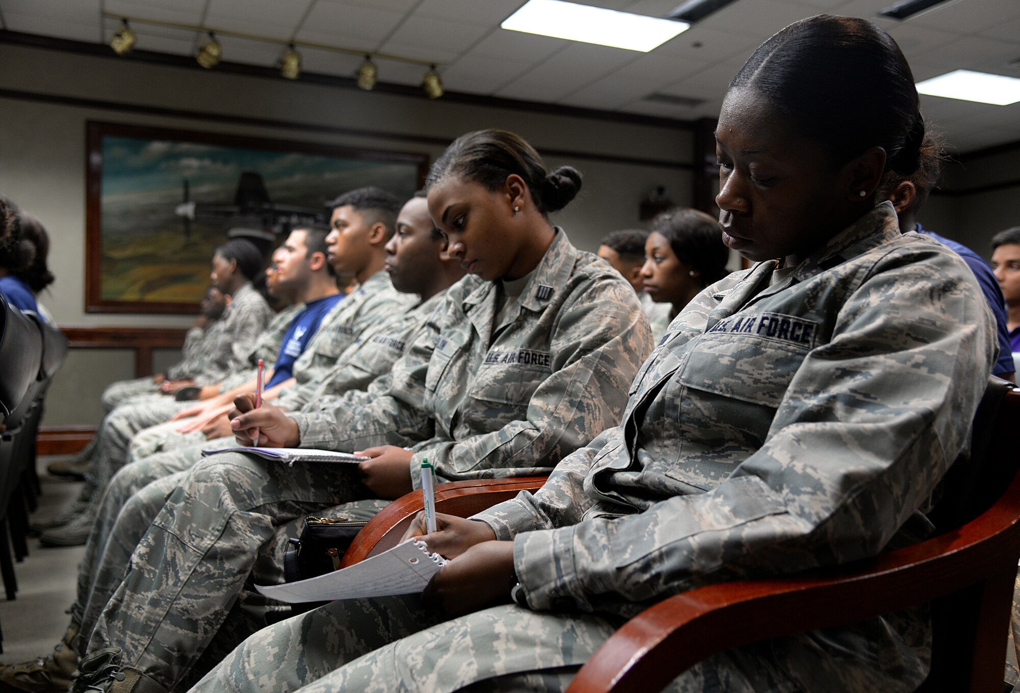 Students of the Southeast and Southwest Region Air Force ROTC Detachments take notes during the opening remarks by Lt. Gen. Steven L. Kwast, Air University commander and president, during the “Pathways to Blue” diversity outreach event April 17, 2015, Keesler Air Force Base, Miss. Hosted by 2nd Air Force, the event provides a way to demonstrate Keesler’s and Air Education and Training Command’s technical and flight training capabilities while informing cadets about career choices available in the Air Force when deciding what path to take after college. (U.S. Air Force photo by Senior Airman Holly Mansfield)