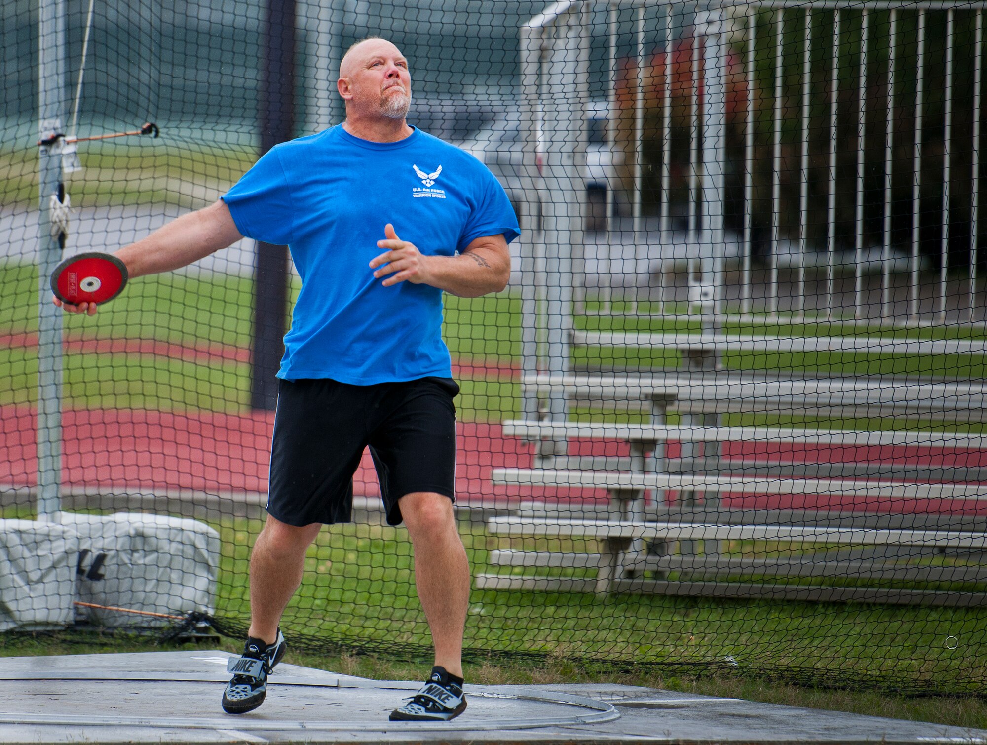 Tim Wymore, an Air Force Wounded Warrior athlete, releases the discus during the first day of the Warrior Games training camp at Eglin Air Force Base, Fla., April 18. The five-day training camp for the Air Force’s athletes serves as their last practice session before the Warrior Games June 19-28. (U.S. Air Force photo/Samuel King Jr.)