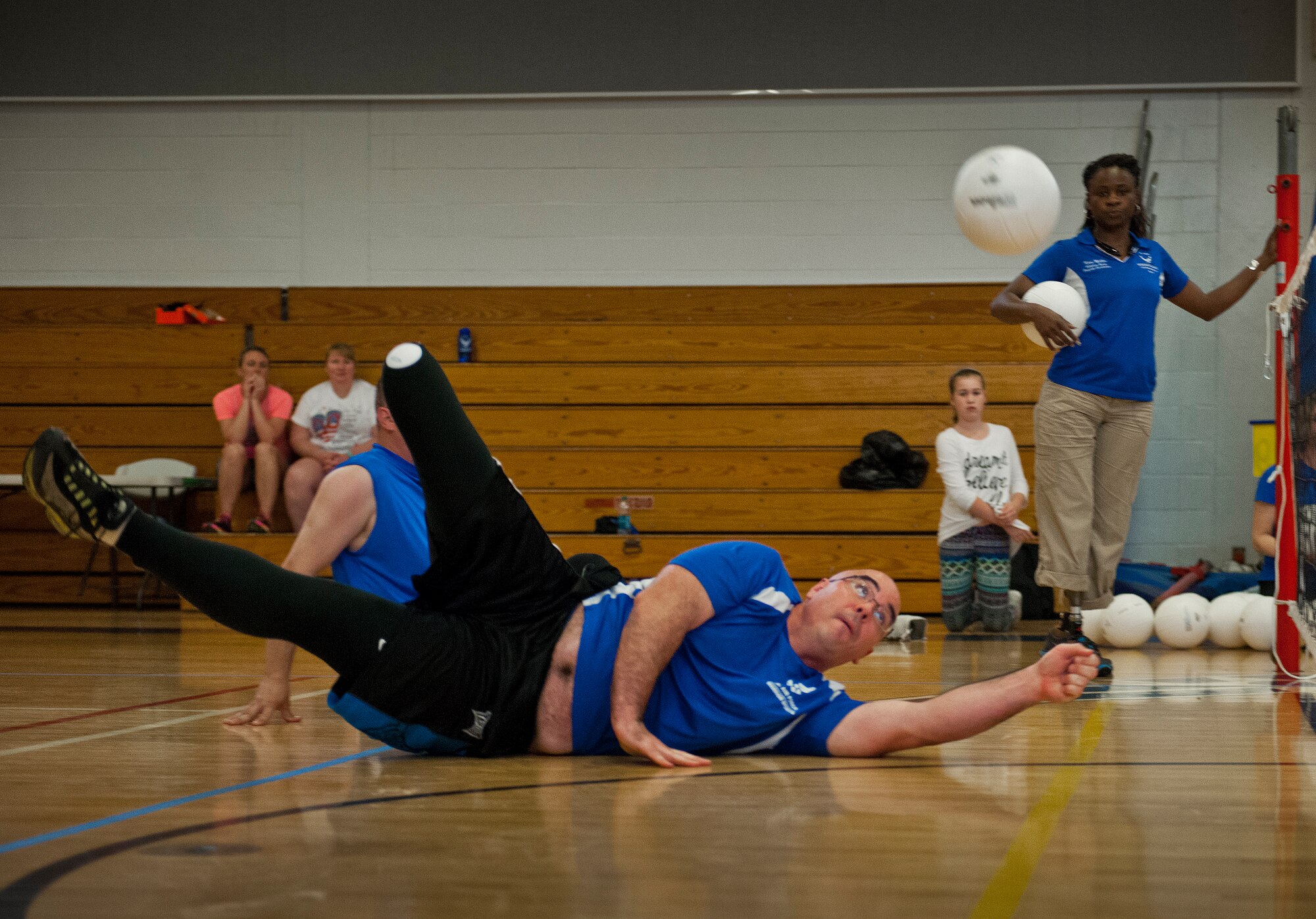 Jason Caswell, an Air Force an Air Force Wounded Warrior athlete, dives for the volleyball to save the rally during the first day of the Warrior Games training camp at Eglin Air Force Base, Fla., April 18. The five-day training camp for the Air Force’s athletes serves as their last practice session before the Warrior Games June 19-28. (U.S. Air Force photo/Samuel King Jr.)