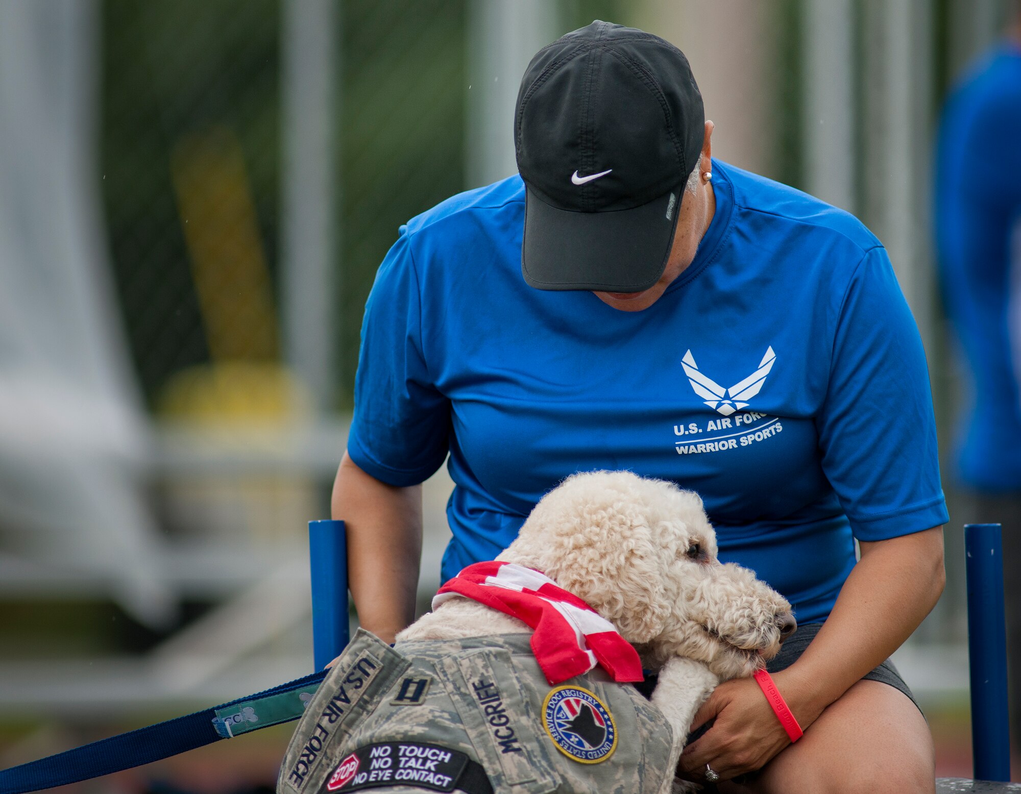Courage provides support to his Air Force Wounded Warrior athlete, Mary McGriff, during the first day of the Warrior Games training camp at Eglin Air Force Base, Fla., April 18. The five-day training camp for the Air Force’s athletes serves as their last practice session before the Warrior Games June 19-28. (U.S. Air Force photo/Samuel King Jr.)