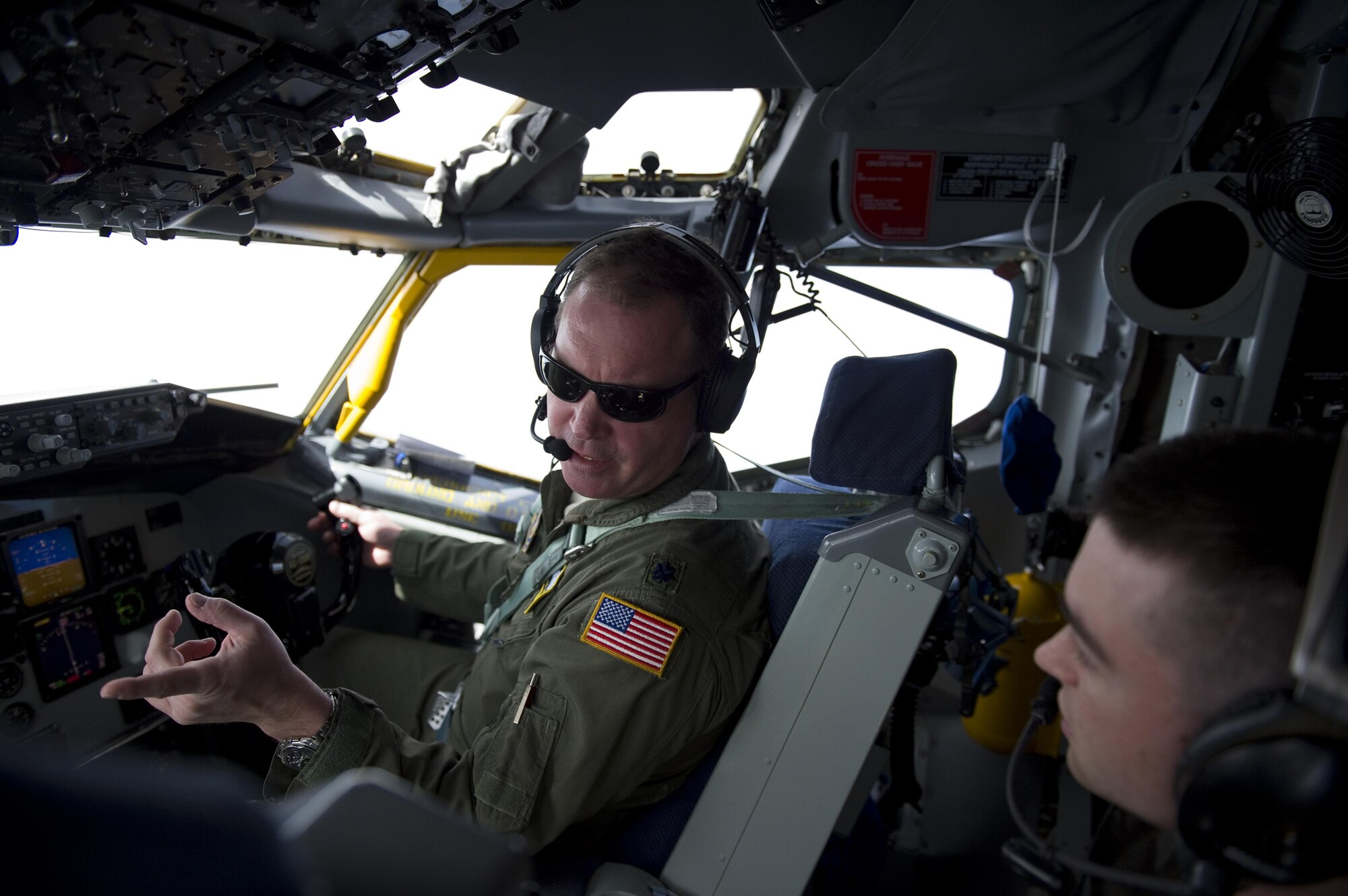 Lt. Col. Joe Austin, 434th Operations Support Squadron KC-135R Stratotanker pilot, explains the pilot’s role during aerial refueling to John Dean, University of Notre Dame Air Force ROTC Detachment 225 cadet, during a refueling mission over Indiana April 1, 2015. During the orientation flight that departed from Grissom Air Reserve Base, Ind., 20 cadets and 6 midshipmen observed the refueling of a C-17 Globemaster III and an A-10 Thunderbolt II. (U.S. Air Force photo/Tech. Sgt. Benjamin Mota)