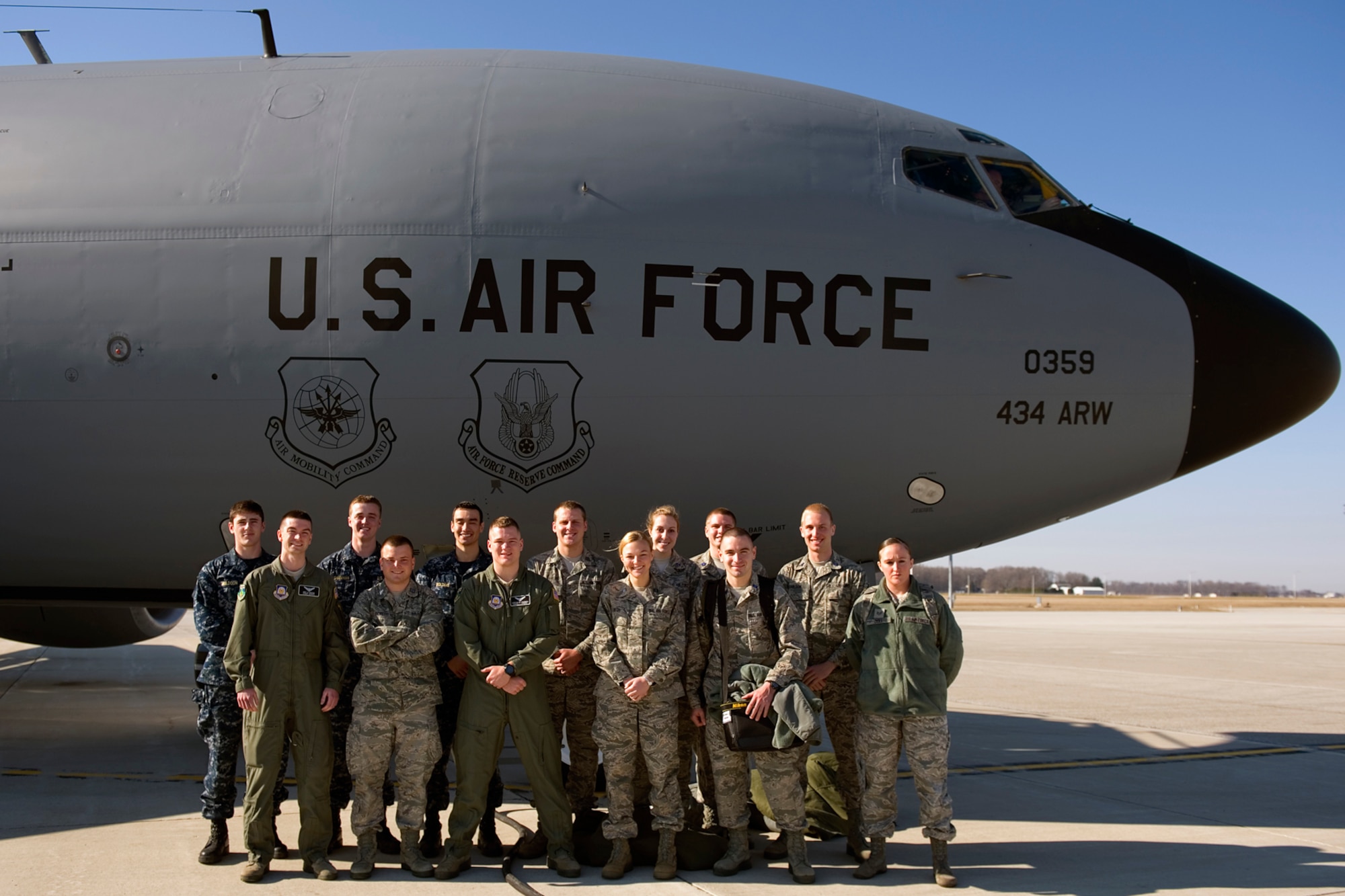 University of Notre Dame Air Force and Navy ROTC cadets and midshipmen pose for a photograph in front of a KC-135R Stratotanker, prior to an orientation flight, at Grissom Air Reserve Base, Ind., April 1, 2015. Orientation flights are conducted by the Air Force to provide individuals a better understanding of aviation related responsibilities with the aircraft and its mission.  (U.S. Air Force photo/Tech. Sgt. Benjamin Mota)