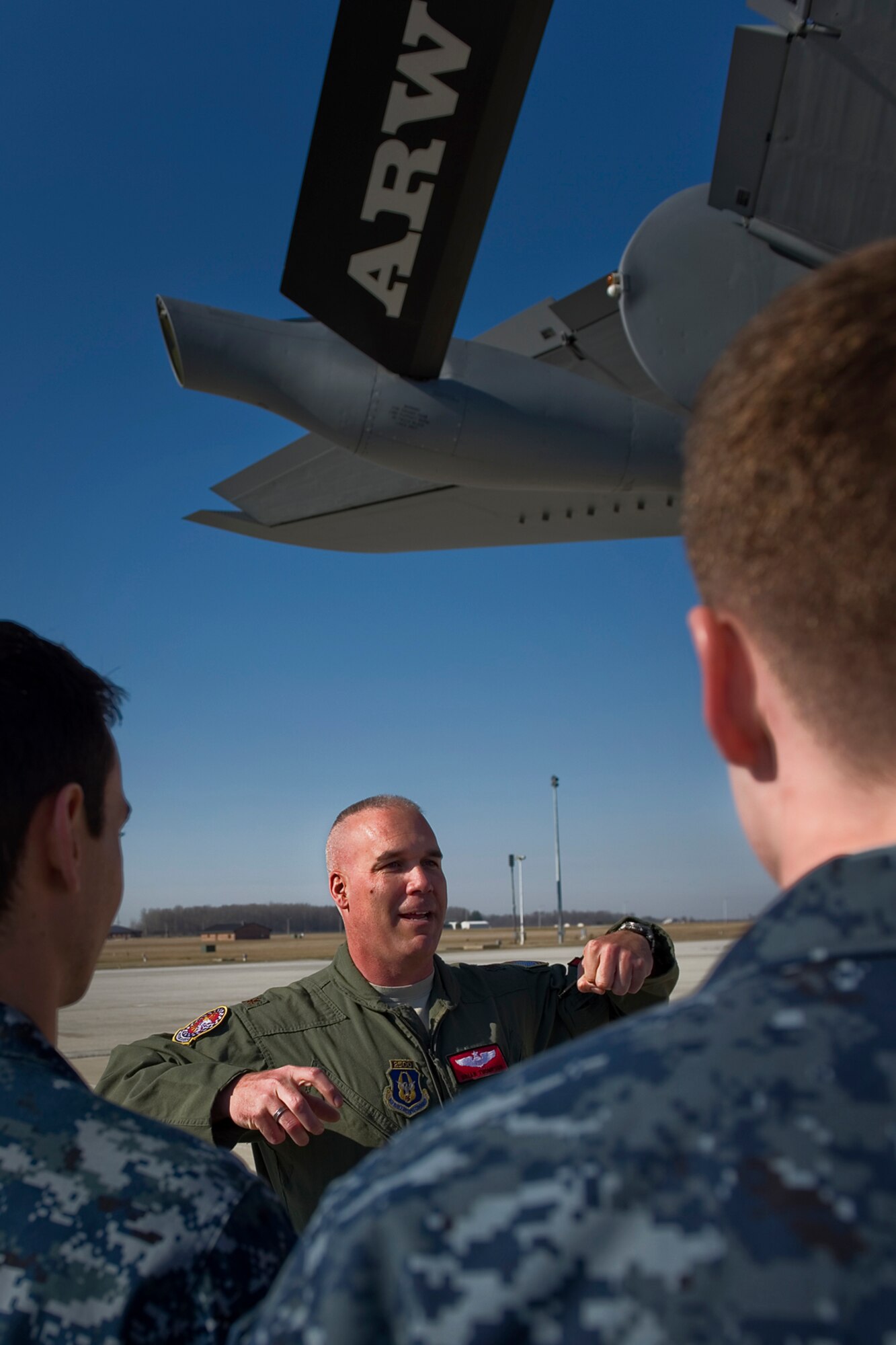 Maj. Brian Thompson, 72 Air Refueling Squadron KC-135R Stratotanker pilot, explains aerial refueling, prior to an orientation flight, to a group of University of Notre Dame Navy ROTC midshipmen, at Grissom Air Reserve Base, Ind., April 1, 2015. During the flight 20 cadets and 6 midshipmen boarded two KC-135Rs to observe the refueling of a C-17 Globemaster III and an A-10 Thunderbolt II. (U.S. Air Force photo/Tech. Sgt. Benjamin Mota)