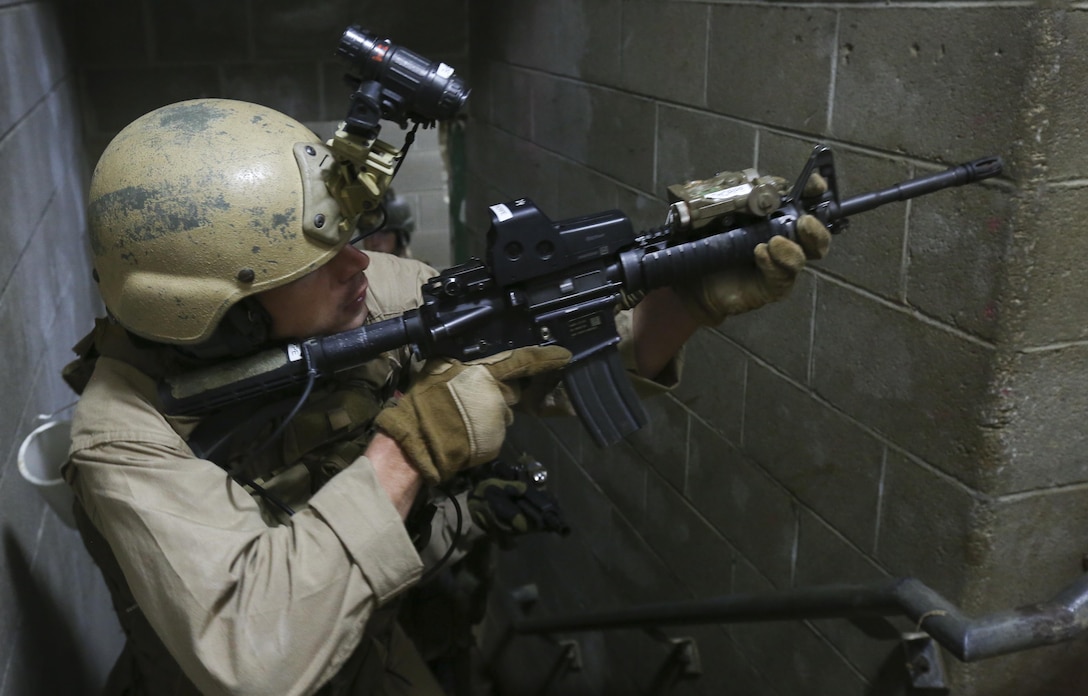 U.S. Marines with Maritime Raid Force, 26th Marine Expeditionary Unit, conduct military operations in urban terrain (MOUT) training at Fort Pickett, Va., April 15, 2015. The training involved role-players, and included room clearing, detainee handling and casualty care. The 26th MEU and its supporting elements are conducting realistic urban training in preparation for deployment to the 5th and 6th Fleet areas of responsibility later this year. (U.S. Marine Corps photo by Cpl. Joshua W. Brown/Released)
