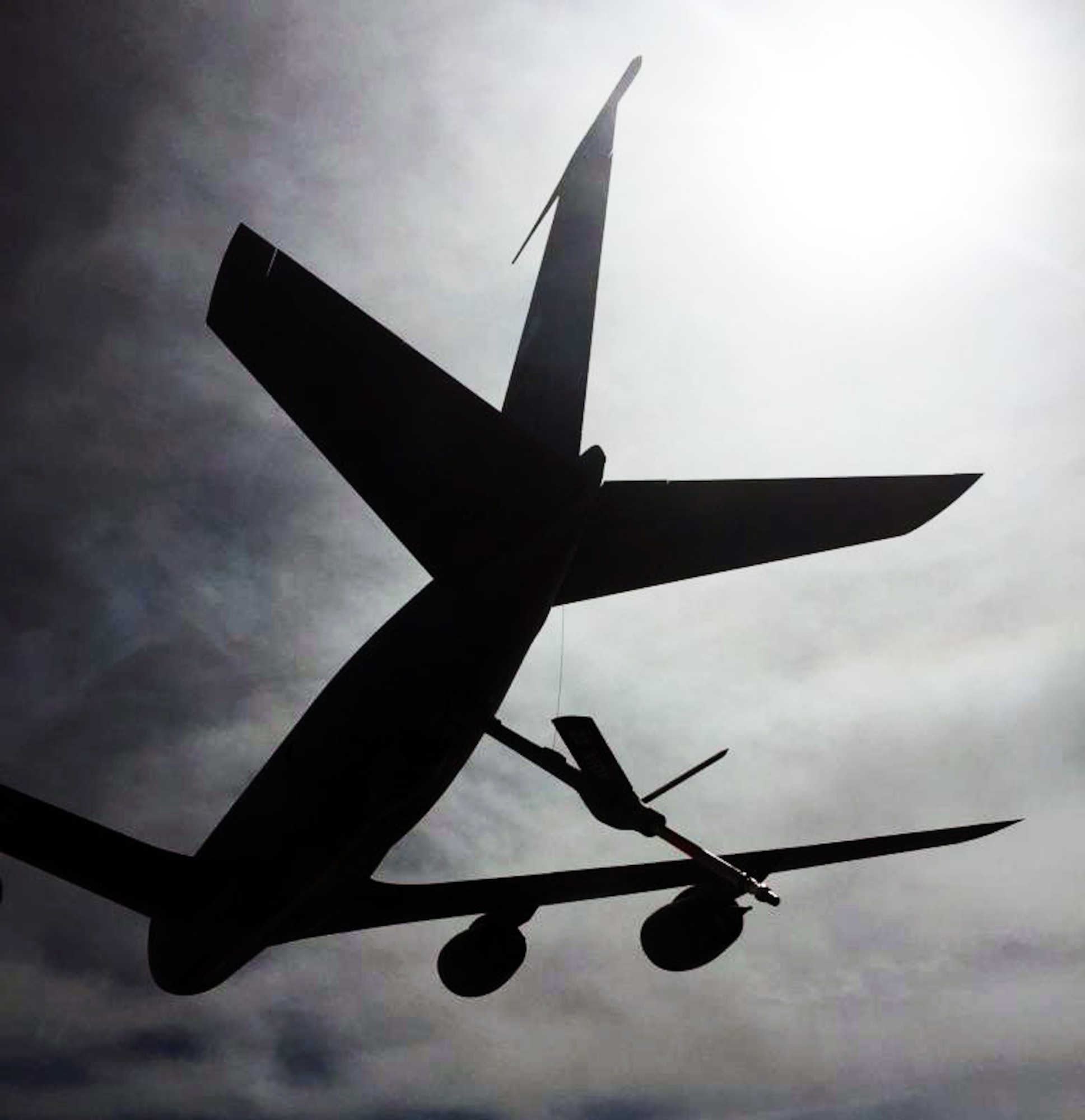 A K-135 Stratotanker assigned to McConnell Air Force Base, Kan., extends its refueling boom during receiver/tanker (R/T) training, April 11, 2015. The KC-135 was operated by an aircrew made up of Air Force Reservists from the 18th Air Refueling Squadron, 931st Air Refueling Group, at McConnell. The R/T training is a critical component to the eventual transition to the KC-46A Pegasus at McConnell. Unlike most KC-135 Stratotankers, the KC-46 has the ability to take on fuel while in flight. The first reserve pilots that will fly the KC-46 are required to be R/T qualified on specially-modified KC-135s before they can even begin the required training at the Boeing Flight Training Facility in Seattle, Wash. Fortunately, the 18th ARS has been actively working with members of the 22nd Air Refueling Wing to ensure that 18 ARS pilots are R/T certified before they attend KC-46 training in Washintgon next May. (U.S. Air Force photo by Senior Master Sgt. Ray Lewis)