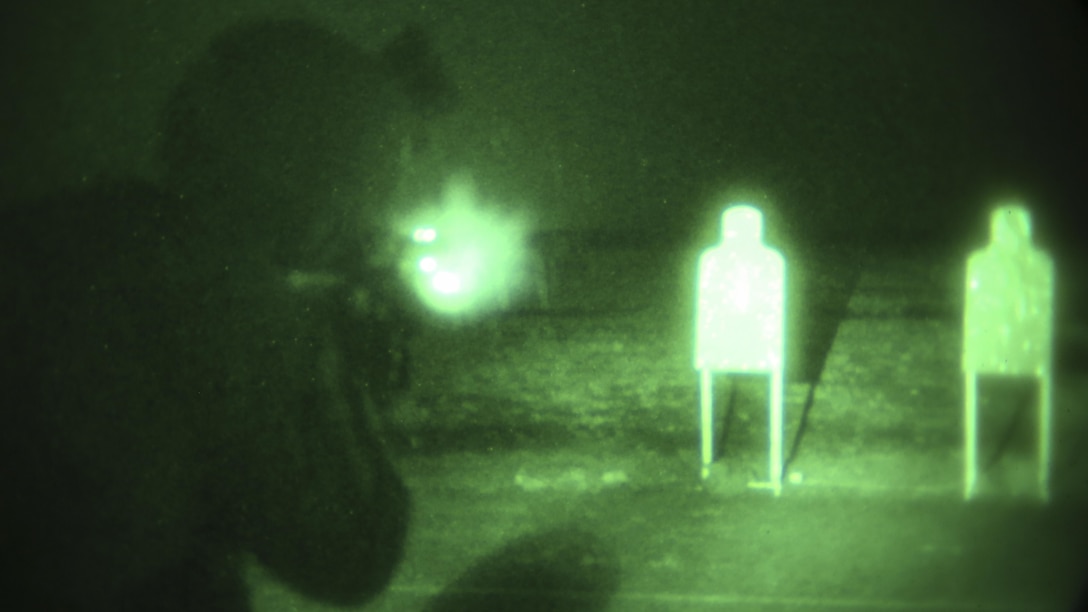A Marine with 2nd Platoon, 2nd Force Reconnaissance Company, II Marine Expeditionary Force fires his M4A1 assault rifle at night during a close-quarters combat tactics course at range K-501A aboard Marine Corps Base Camp Lejeune, N.C., April 15, 2015. Marines built upon training in techniques and tactics in preparation for the 22nd Marine Expeditionary Unit slated to deploy in 2016. 