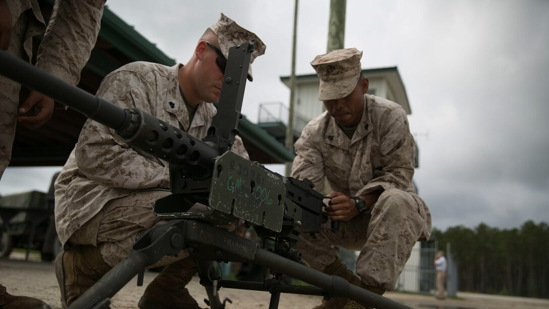 Marines with 8th Engineer Support Battalion, 2nd Marine Logistics Group, practice weapons safety rules with the M2 .50-caliber heavy machine gun during a live-fire training exercise at a multipurpose machine gun range at Marine Corps Base Camp Lejeune, North Carolina, April 14, 2015. Marines from various units within 8th ESB volunteered to be a part of a live- fire exercise, refining their knowledge of the M240 Bravo and the M2 .50-caliber machine gun. 
