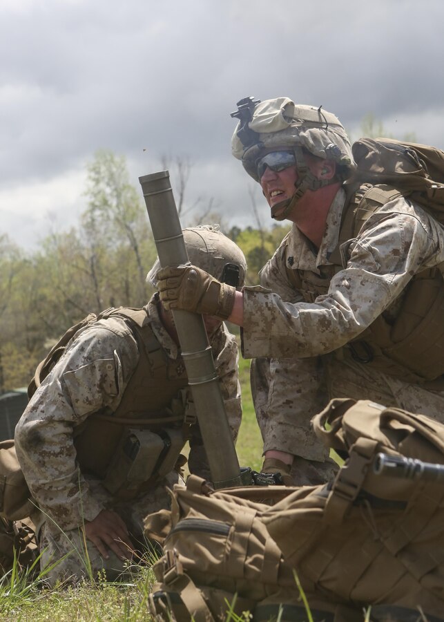 U.S. Marines with Golf Company, Battalion Landing Team 2/6, 26th Marine Expeditionary Unit (MEU), fire a round from a M224 60 mm lightweight mortar during an infantry platoon battle course at Fort Pickett, Va., April 17, 2015. The mortarmen cleared targets at unknown distances so other friendly units could advance further through the course. The 26th MEU and its supporting elements are conducting realistic urban training in preparation for deployment to the 5th and 6th Fleet areas of responsibility later this year. (U.S. Marine Corps photo by Cpl. Joshua W. Brown/Released)
