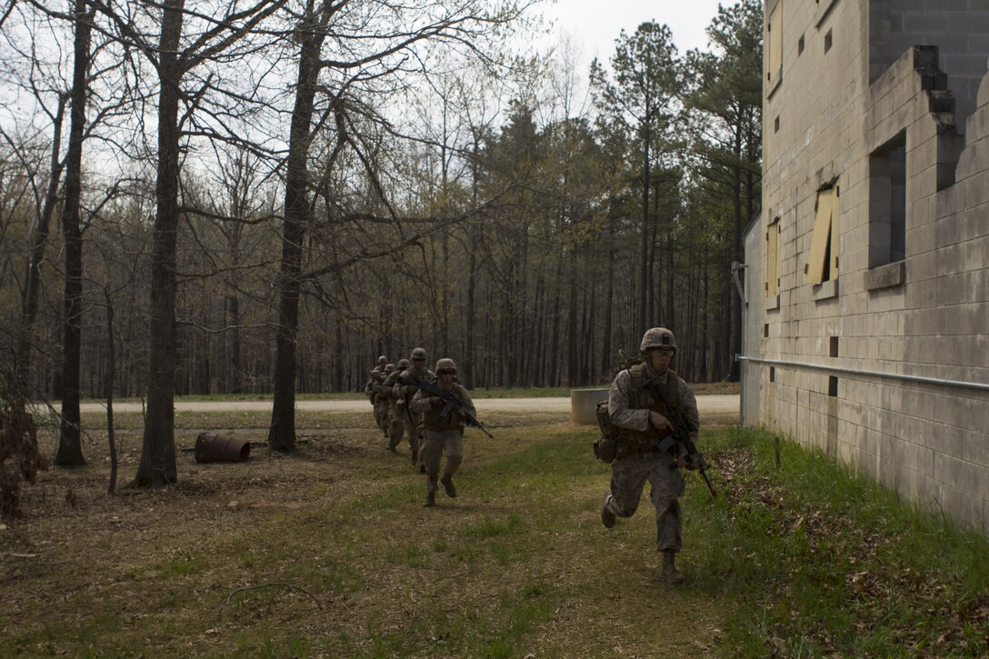 U.S. Marines with Golf Company, Battalion Landing Team 2/6, 26th Marine Expeditionary Unit (MEU), move towards their objective during military operations in urban terrain training at Fort Pickett, Va., April 11, 2015. The 26th MEU and its supporting elements are conducting realistic urban training in preparation for deployment to the 5th and 6th Fleet areas of responsibility later this year. (U.S Marine Corps Photo by Cpl. Jalen D. Phillips/Released)