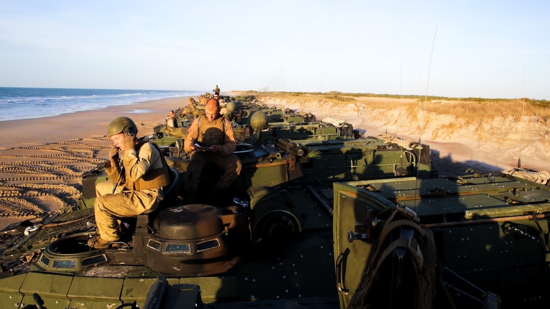 Marines with 3rd Platoon, Alpha Company, 2nd Assault Amphibian Battalion prepare their amphibious assault vehicles to leave the shore of Onslow Beach, Camp Lejeune, N.C., and embark the multipurpose amphibious assault ship USS Kearsarge (LHD-3) April 12, 2015. The platoon used amphibious assault vehicles to transport Marines from 1st Battalion, 6th Marine Regiment in support of a ship-to-shore exercise off the coast Onslow Beach. 