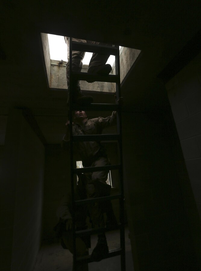 U.S. Marines with Maritime Raid Force, 26th Marine Expeditionary Unit, conduct drills to clear the roof of a building during an urban assault course at Fort Pickett, Va., April 14, 2015. The 26th MEU and its supporting elements are conducting realistic urban training in preparation for deployment to the 5th and 6th Fleet areas of responsibility later this year. (U.S. Marine Corps photo by Cpl. Joshua W. Brown/Released)