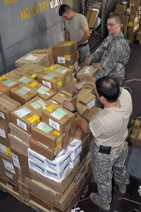 Members of the 814th Area Support Medical Company of the North Dakota National Guard sort through medical supplies in preparation for MEDFLAG 10. Participants arrived in Kinshasa, Democratic Republic of Congo and began to prepare for MEDFLAG 10, a joint medical exercise focused on humanitarian assistance that will take place in Kinshasa, Sept. 6-18, 2010.