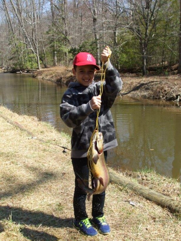 Tyler, 9, displays the trout he caught at Secon Pool on Saturday during Virginia’s Heritage Fishing Day.