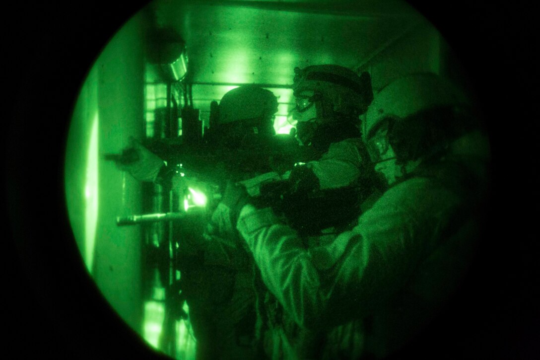 U.S. Marines assigned to Force Reconnaissance Platoon, Maritime Raid Force, 26th Marine Expeditionary Unit (MEU) clear a ship while conducting Visit, Board, Search, and Seizure (VBSS) training at Joint Base Langley-Eustis, Va., April 10, 2015. The exercise was part of the 26th MEU’s pre-deployment training, and allowed the Marines to enhance their skills in maritime operations. (U.S. Marine Corps photo by Lance Cpl. Andre Dakis/26th MEU Combat Camera/Released)