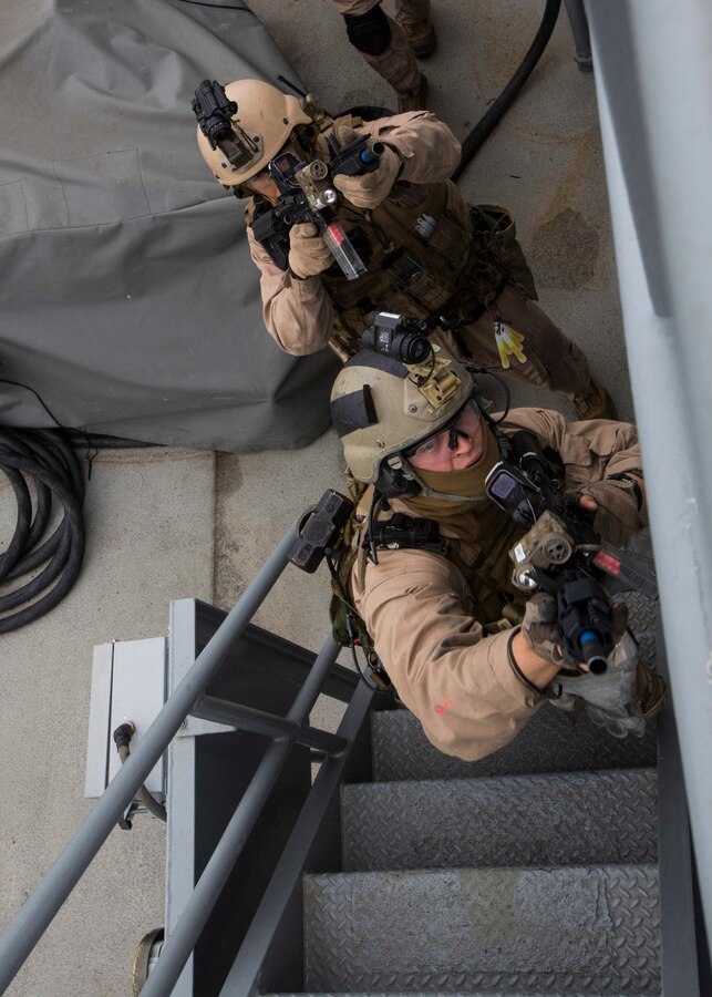 U.S. Marines assigned to Force Reconnaissance Platoon, Maritime Raid Force, 26th Marine Expeditionary Unit (MEU) clear a ship during Visit, Board, Search, and Seizure (VBSS) training at Joint Base Langley-Eustis, Va., April 14, 2015. The Marines were evaluated on their training as part of preparation for deployment to the 5th and 6th Fleet Areas of responsibility later this year. (U.S. Marine Corps photo by Lance Cpl. Andre Dakis/26th MEU Combat Camera/Released)