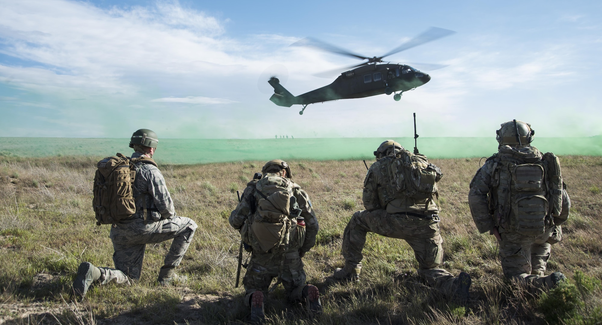 An Army UH-60 Blackhawk lands to pick up 366th Security Forces Squadron and 124th Air Support Operation Squadron members during Gunfighter Flag 15-2 at Saylor Creek Range, Idaho, April 15, 2015. The exercise allowed joint service members a chance to execute realistic operation scenarios in an environment similar to Southwest Asia. (U.S. Air Force photo/Staff Sgt. Roy Lynch III)